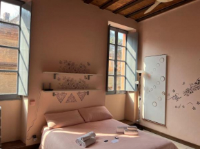 Minimal Studio con travi a vista